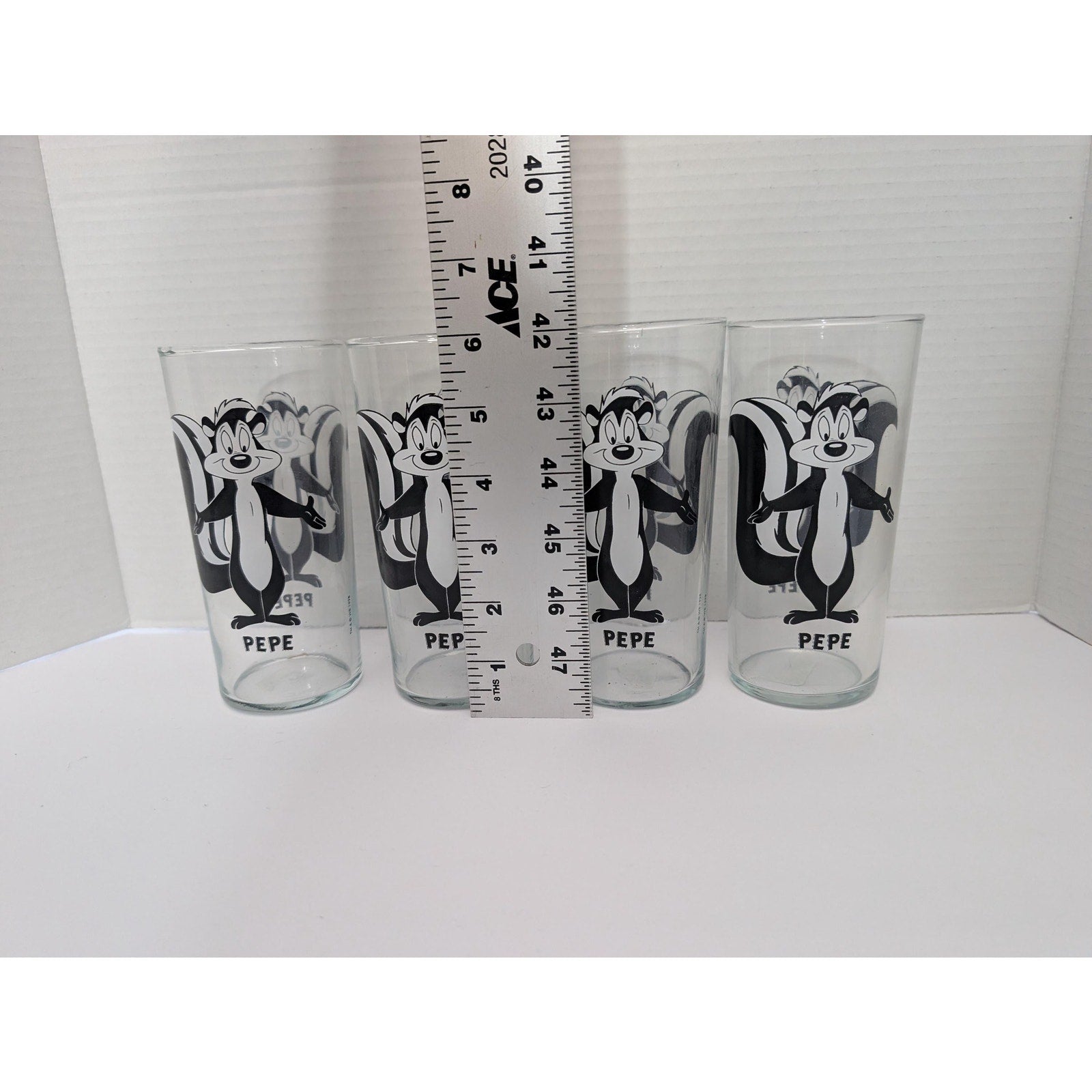 Set of 4 Vintage 1998 Pepe Le Pew Glass Set Looney Tunes Warner Bros Black and White Tumblers